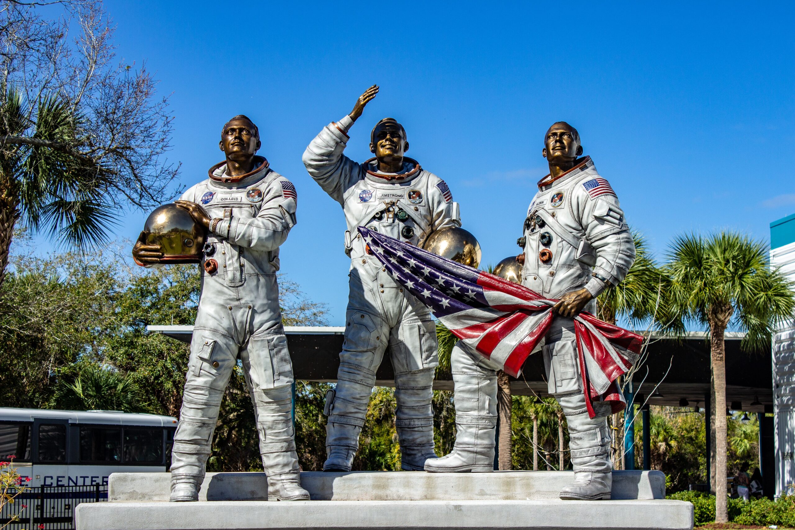 Statue of Apollo astronauts holding an American flag at Kennedy Space Center, Florida.
